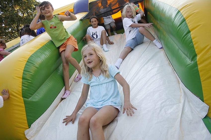 ODA children loved tumbling down this inflatable bounce house.