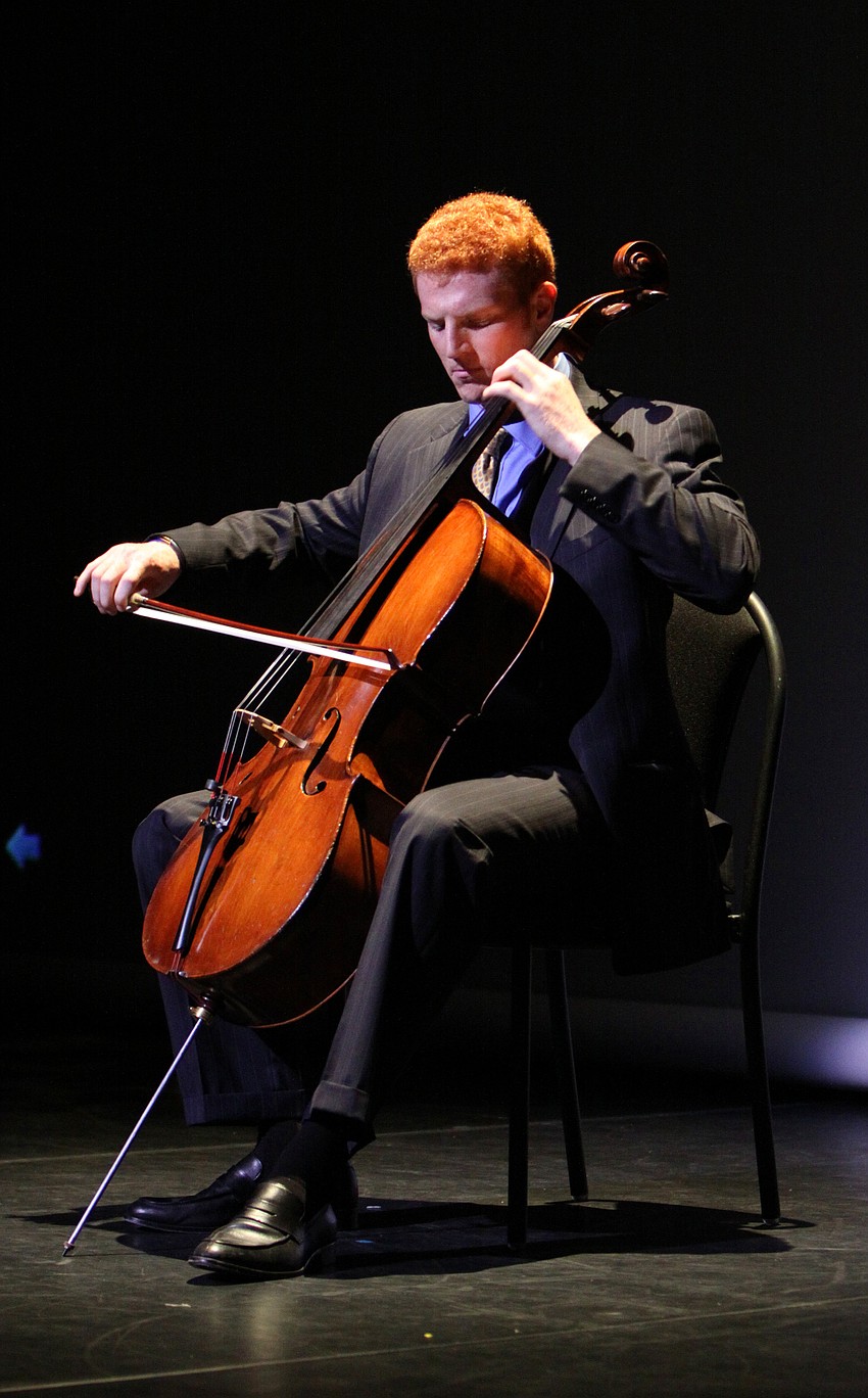 Abraham Feder performs a cello solo as part of the Tribute in Memory of Virginia Toulmin.