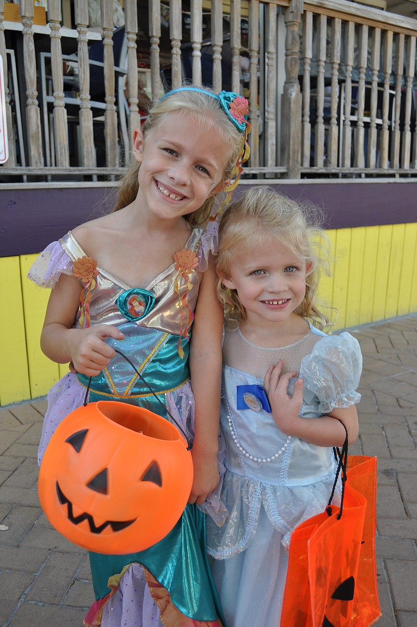 Madelyn and Mikayla Schuth dressed as their favorite Disney princesses, Ariel and Cinderella.