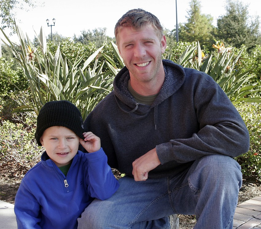 Marine Corps. veteran Daniel Furner brought his 3-year-old son Austin to the walk.