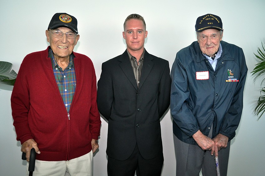 Al Clark, 93, the oldest Marine present at the event; Drew Mallon, 27, youngest Marine present; and Gordon Brooks, 94, the oldest person present