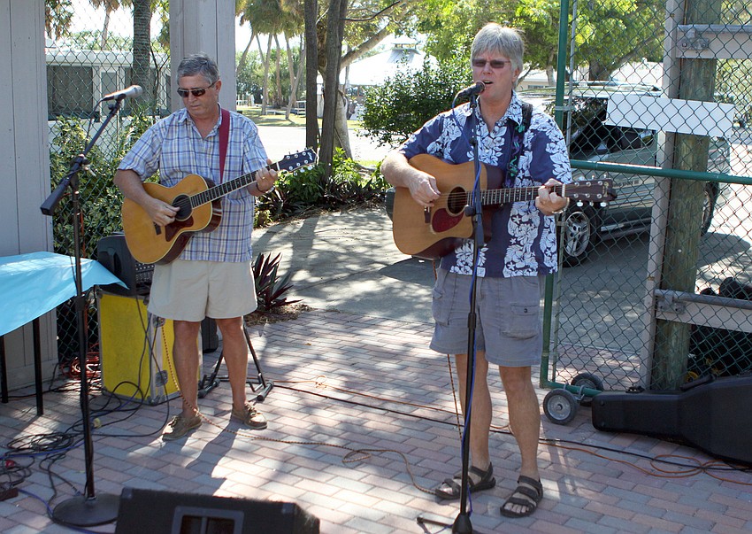 Jim Morris and Sunny Jim White entertain the crowd with fun and tropical music during the birthday party for S.O.S.