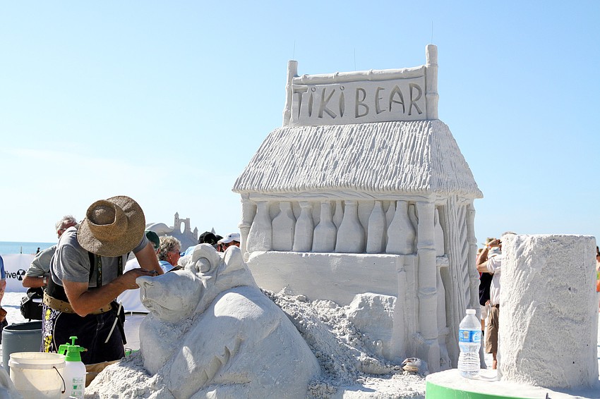 Ronald MacDonald works on the bear for his sculpture â€œTiki Bearâ€.