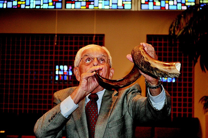 Ralph Cohen sounds the shofar.