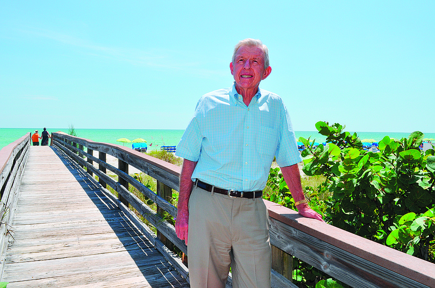 Chuck Cobb stands in August on the beach near the Longboat Key Club and Resort, an area that was largely undeveloped when Cobb became CEO of Arvida in 1972.