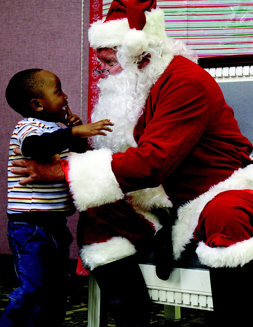 Rashad Smith Jr. asked Santa for a motorcycle at the Healthy Families Sarasota Holiday Party in December.
