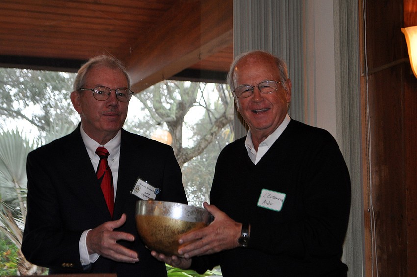 Aldo Massara, a unit owner and member of the landscaping committee at L'elegance Condominiums, accepts a special commendation from Andy Papineau for being the Garden Clubâ€™s first corporate members.