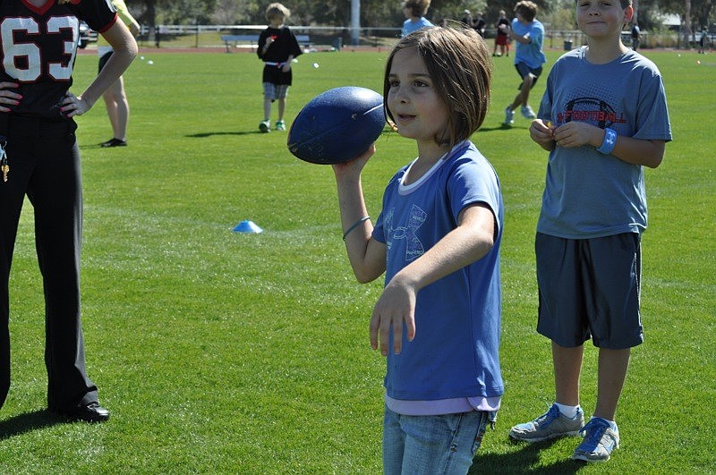 Kennedy Weber, 8, tried her hand at the quarterback toss.