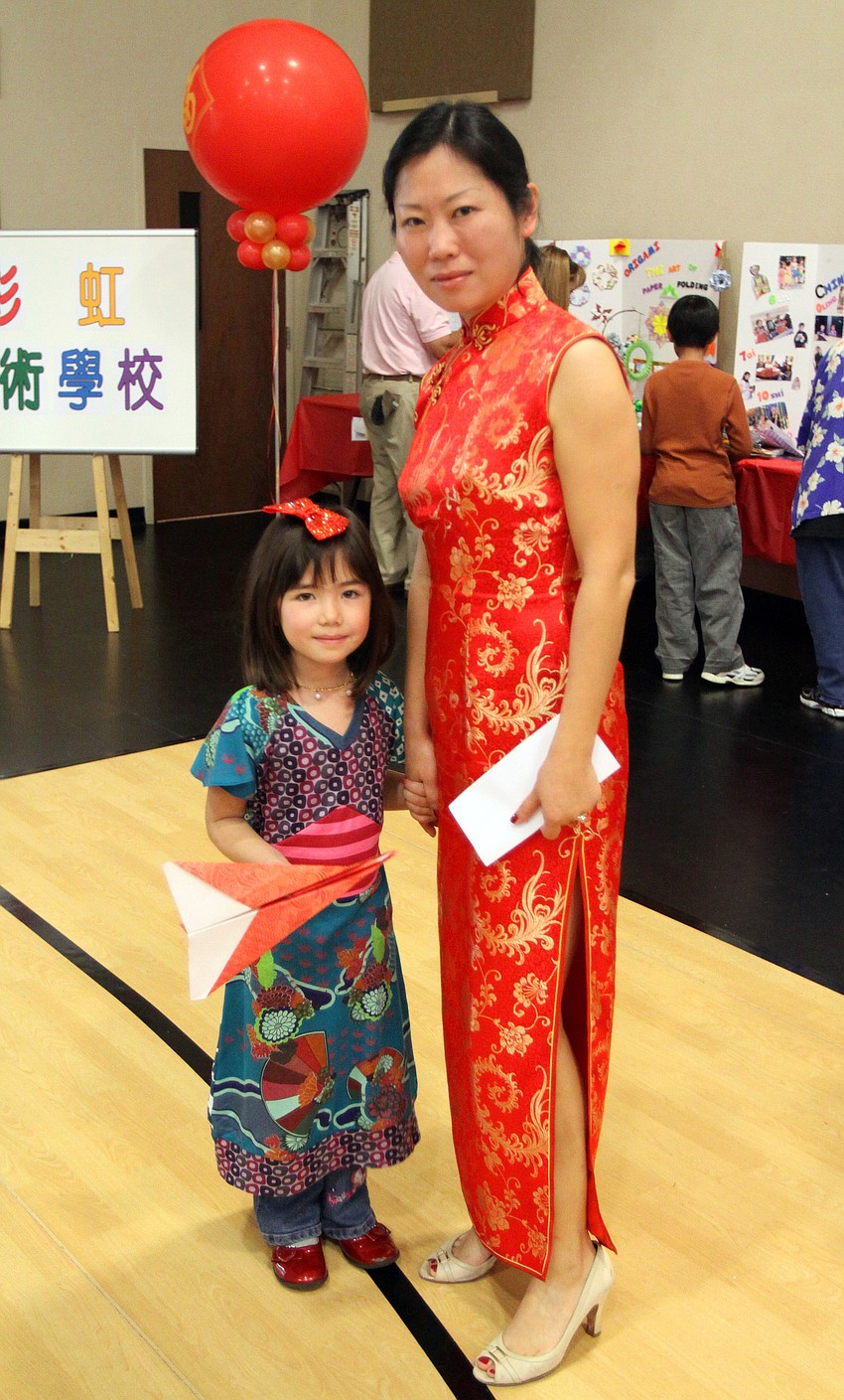 Lauren Pierce and Ye Gong pose together on Saturday, Jan. 29 at the 2011 GCAA Chinese New Year Celebration held at T.J. Johnson Youth Center.