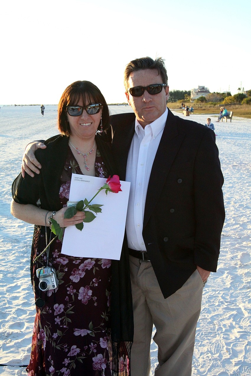 Margaret and John Venture, married for 5 years, enjoy their Valentine's Day by attending the Say I Do, Again ceremony, Monday, Feb. 14 on Siesta Key Beach.