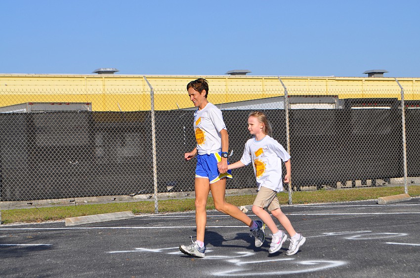 April Bell and Leah Brown ran hand-in-hand.
