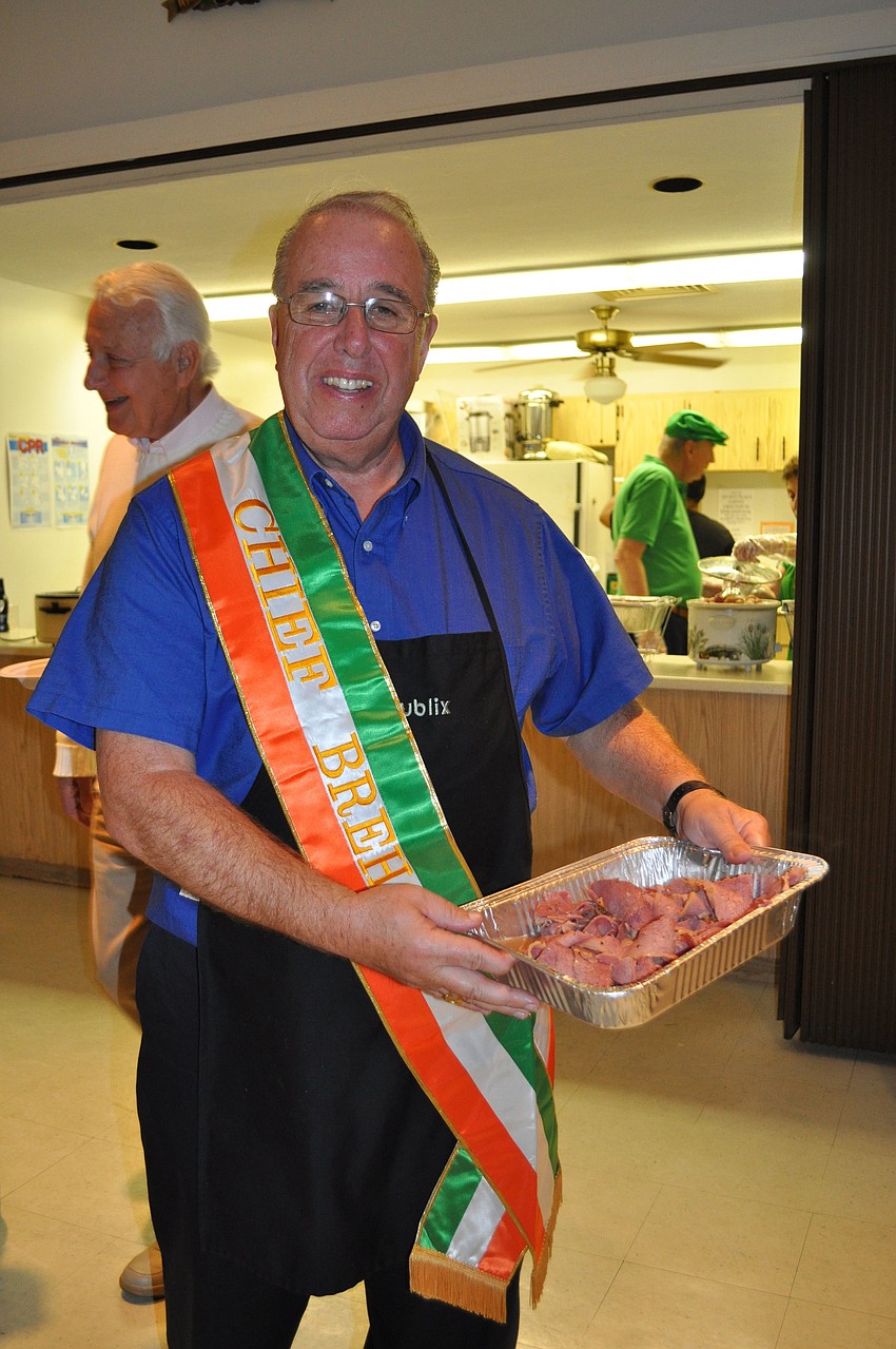 Grand Knight George Haviland delivers piping hot corned beef to the buffet table.