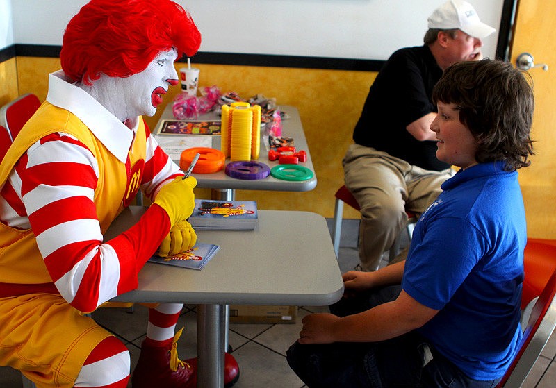 Fifth-grader, Max Hamel, talks with Ronald McDonald.