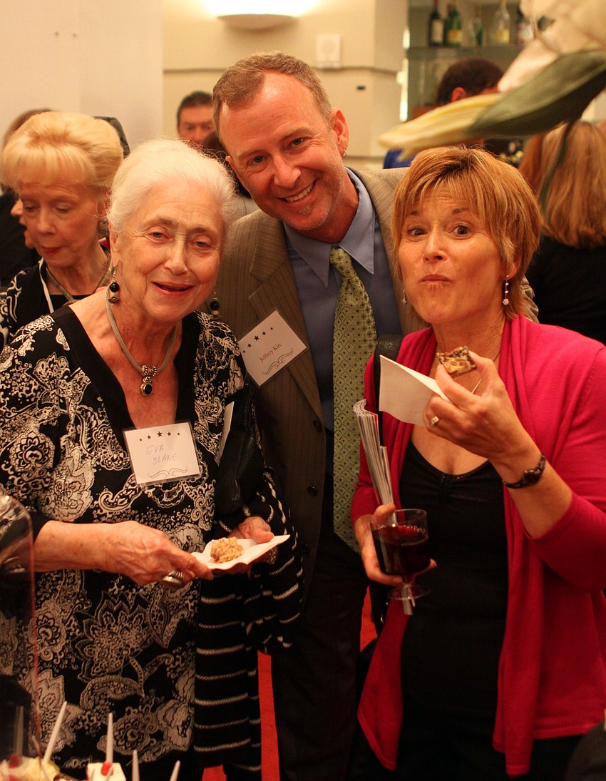 Eva Slane, Jeffery Kin and Deb Lombard enjoy their desserts in the lobby following the awards ceremony.