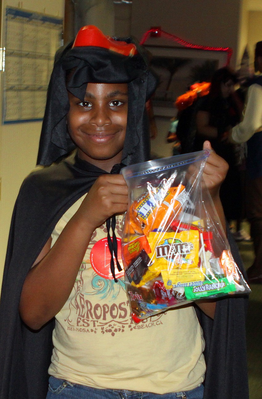 Jada Barbour shows off all the candy she collected from Merrill Lynch and UBS.