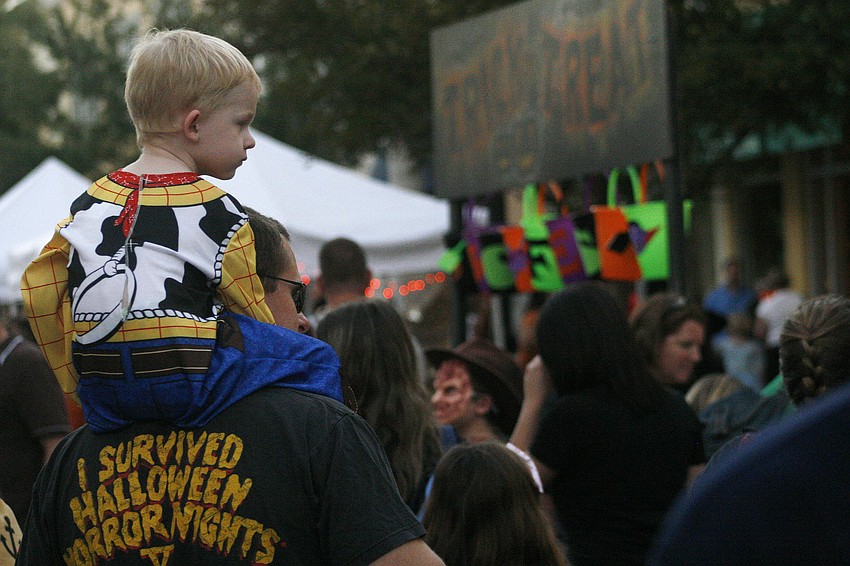 Jonathan Townsley, 3, hitched a ride atop his dad's shoulders.