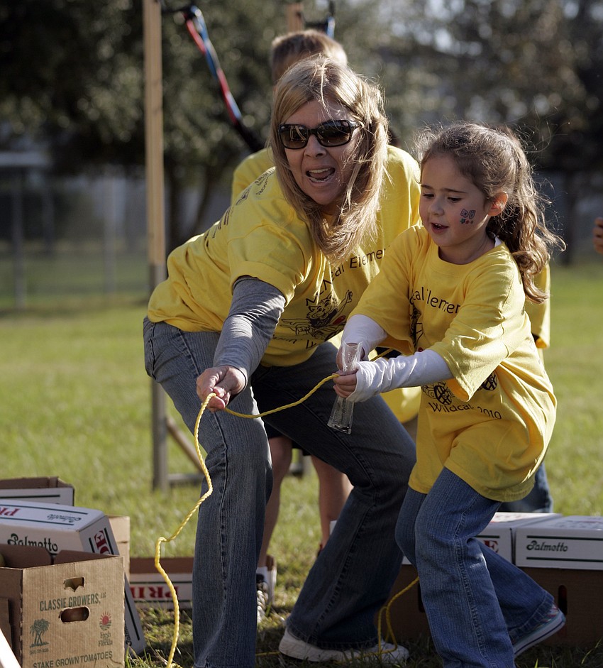 Six-year-old Nikita Brand had a blast launching the tomato catapult.