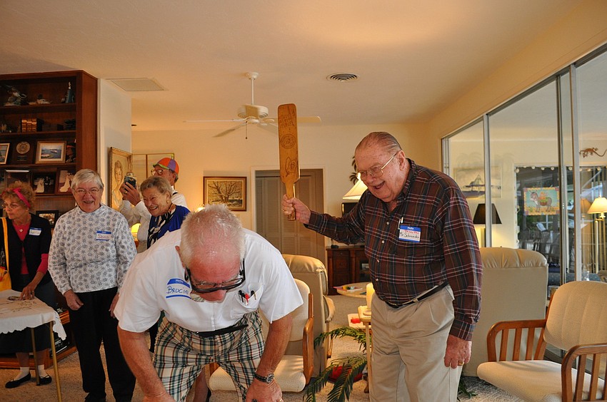 Bruce Schaefer gets a paddling from principal Bob Schroeder