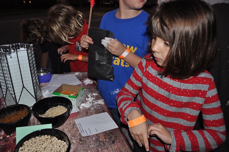 Alaina Chapman, 6, mixed up her own potion.