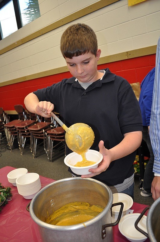 Joshua Monteith, 13, dished out broccoli and cheese soup.