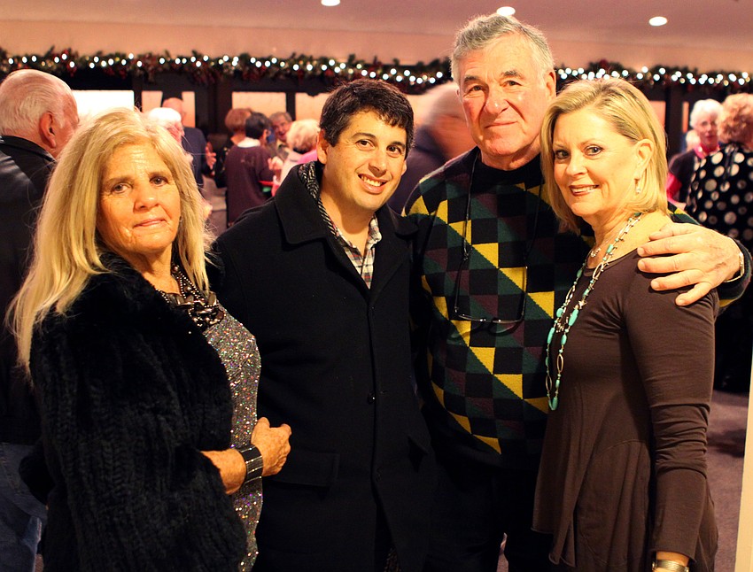 Bunny Herman and her son, Cpt. Tommy Herman, pose with Dr. Jerry Herman and his wife Judy. The family has been Longboaters for years and lives at Seaplace.