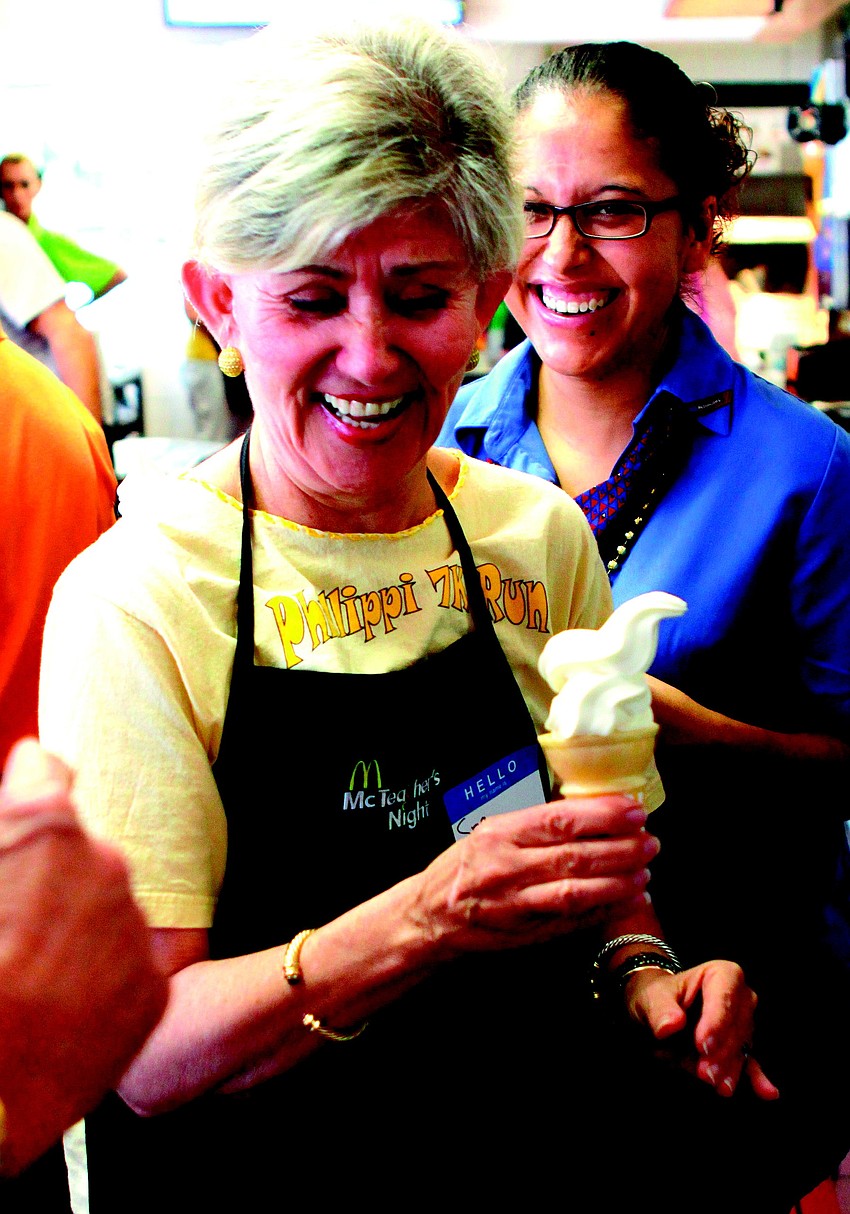 Itzel Lieberman, Spanish teacher at Phillippi Shores Elementary, laughed at her attempt at serving up the perfect swirl of soft serve, while participating in 