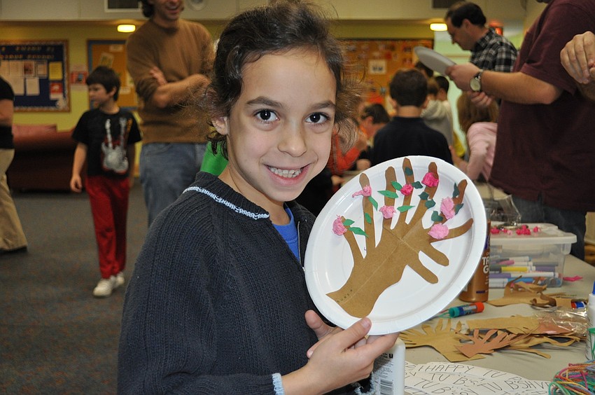 Gaya Nadel makes a tree ornament.