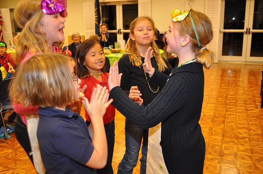Margaret Buck, Christina Brush, Amelia Menke, Avery Morse congratulate spoon contest winner Morgan Christiansen.