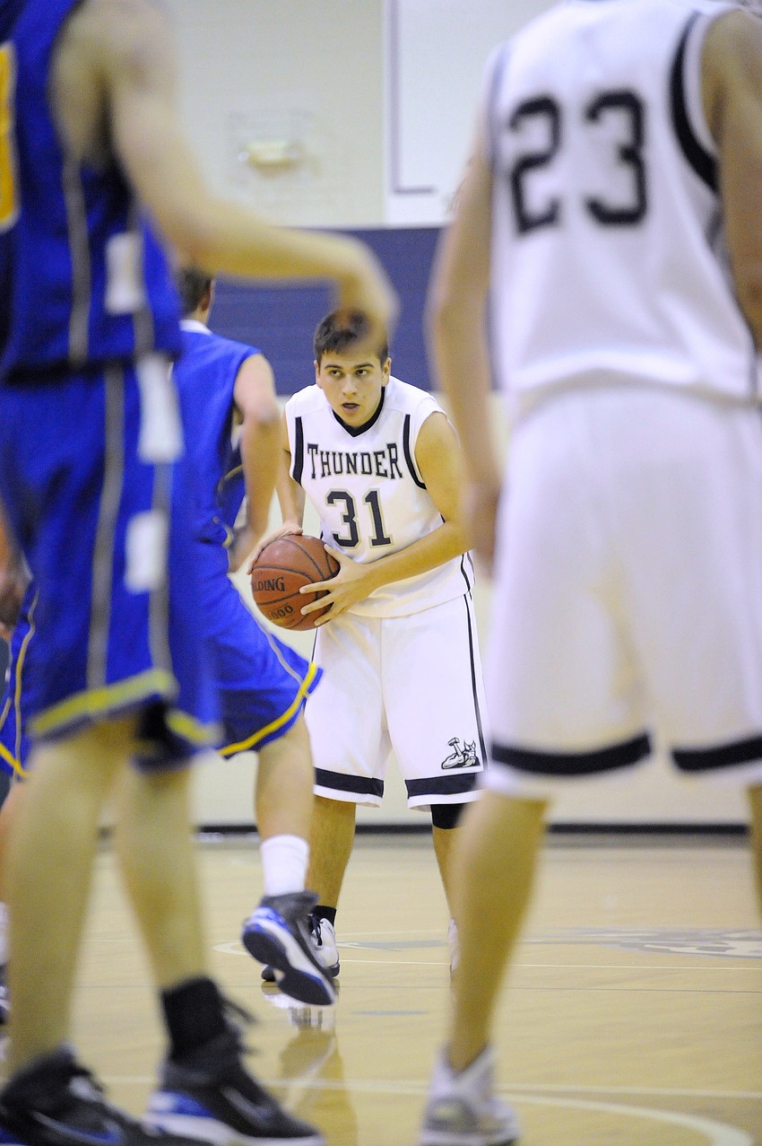 ODA's Joe Grano, who finished with five assists, brings the ball up the court.