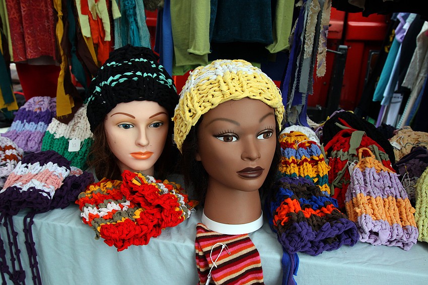 Manakin heads wear hats created by Dee Dee Derenne and Delight Cash who run a booth at the farmers market called Dee Dee & Delight's Eco-Friendly Clothing.