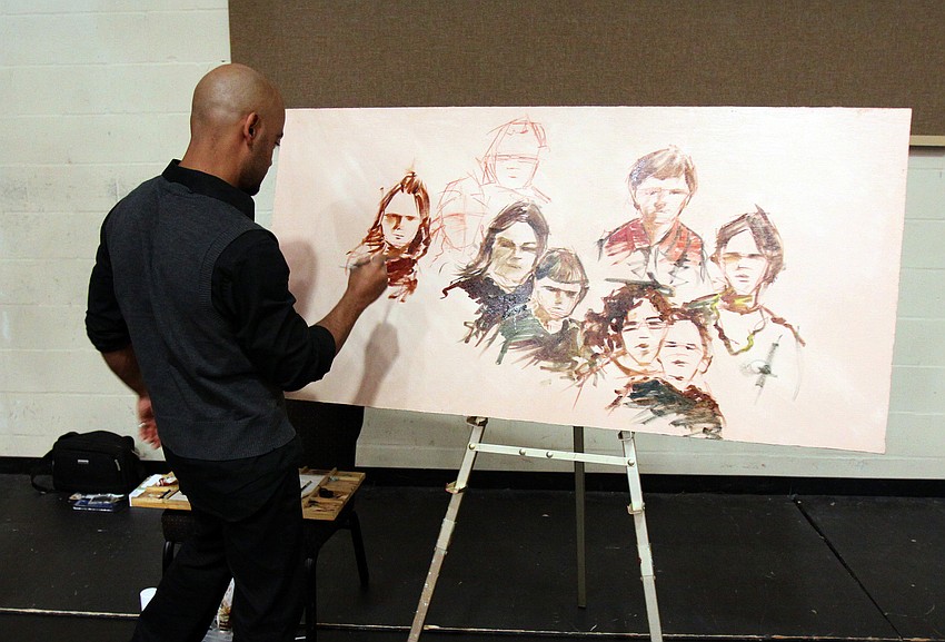 Javier Rodriguez works on a painting on Saturday, Jan. 29 at the 2011 GCAA Chinese New Year Celebration held at T.J. Johnson Youth Center. Rodriguez will be one of two artist ambassadors heading over to Sarasota's Chinese Sister City, Xiamen.