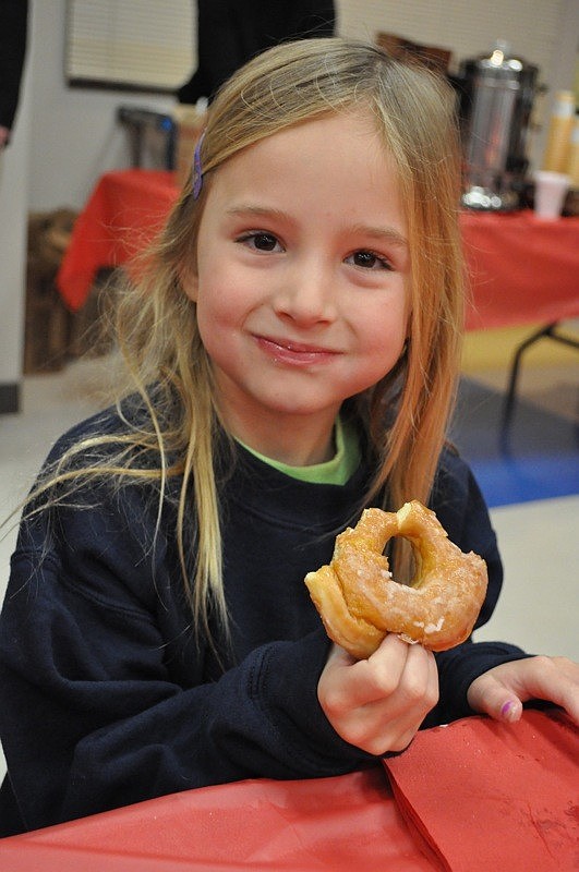 Estella Hornback, 5, feasted on a glazed doughnut with her dad, Charles, not pictured.