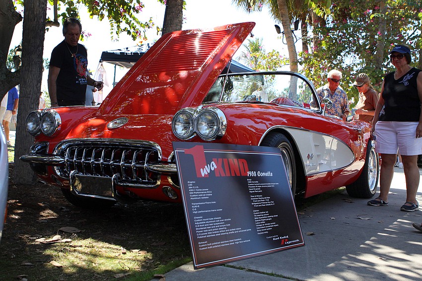 People check out Karl Kudick's 1 uva Kind 1958 Corvette on Saturday, Feb. 19 at the Sarasota Exotic Car Fest in St. Armand's Circle