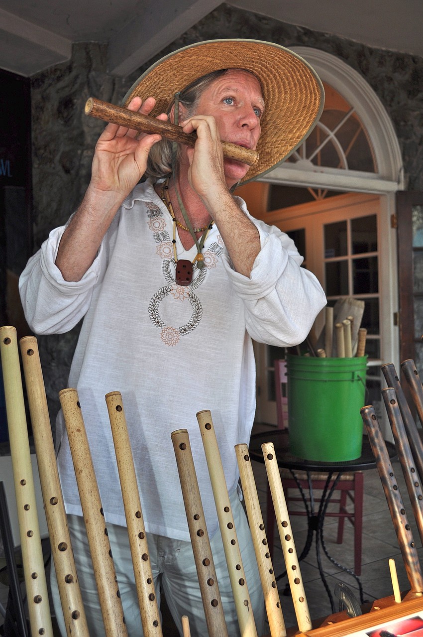 George Tortorelli plays a bamboo flute.