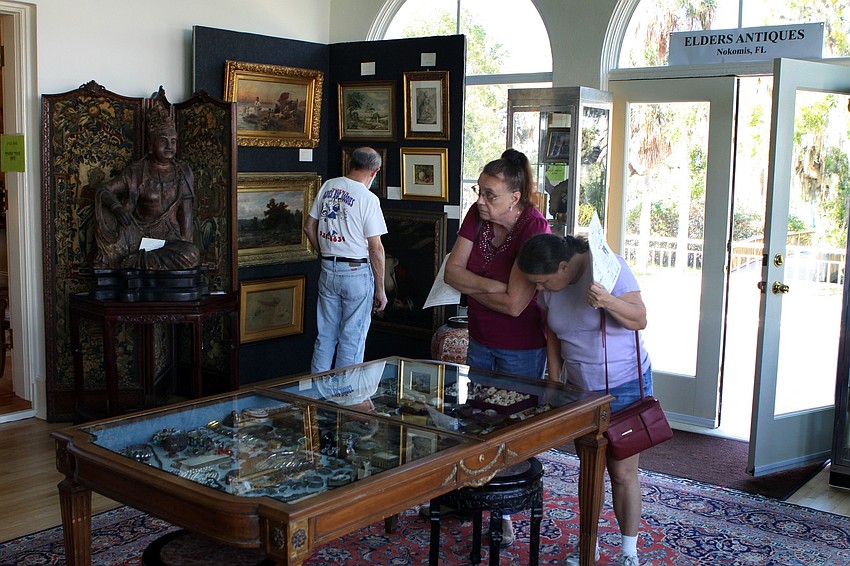 People look around at the antiques brought by Elders Antiques inside the mansion on Sunday, Feb. 20 at the Historical Society of Sarasota County's 2nd Annual Antiques and Appraisals Event, at Phillippi Estate.