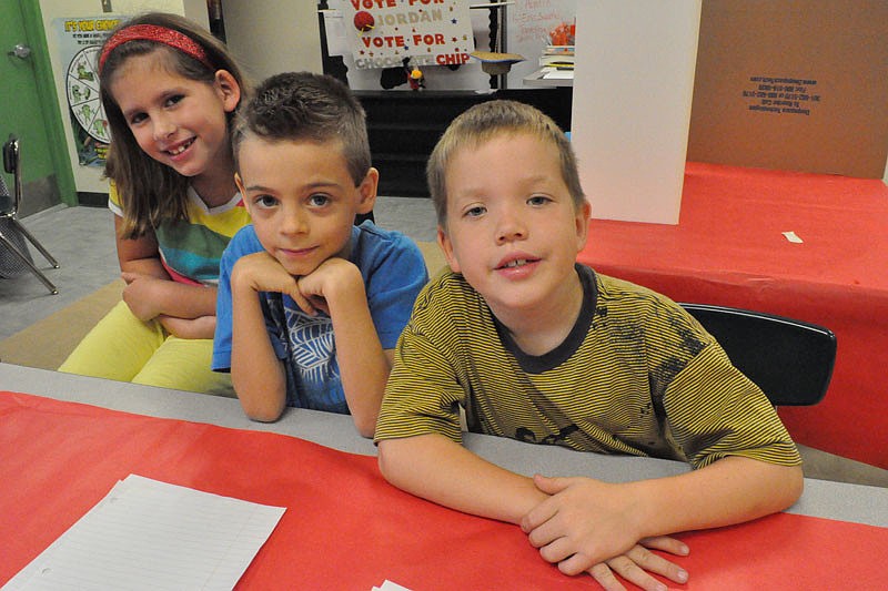 Ashley Zeitz, Kyle Smith and Zach Kerkof checked in voters.
