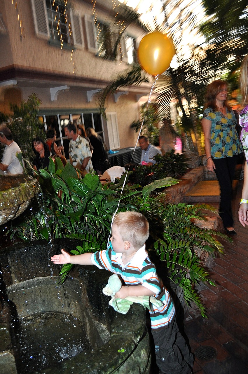 Gavin Perkowski sneaks a peak at the water fountain.