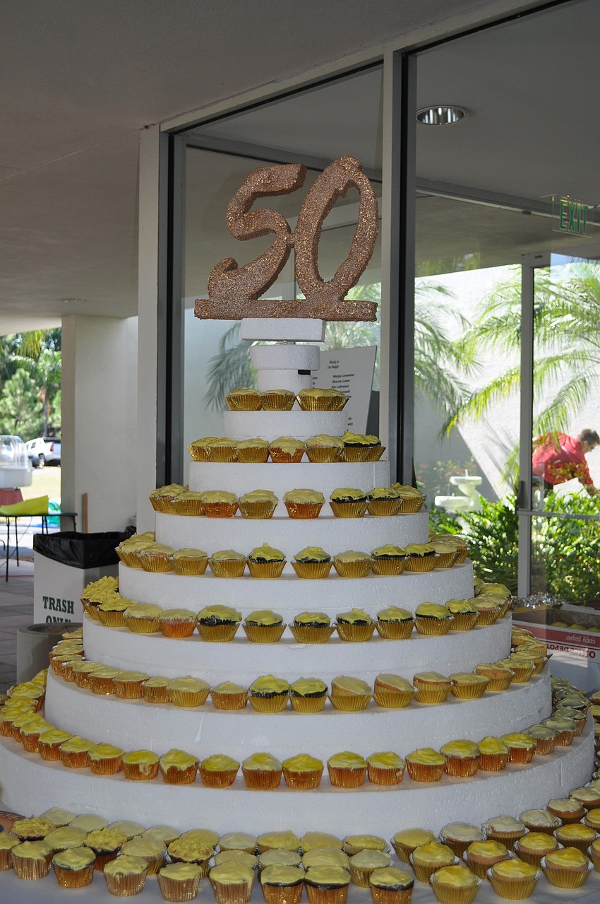 Hundreds of cupcakes with gold icing were made for the celebration