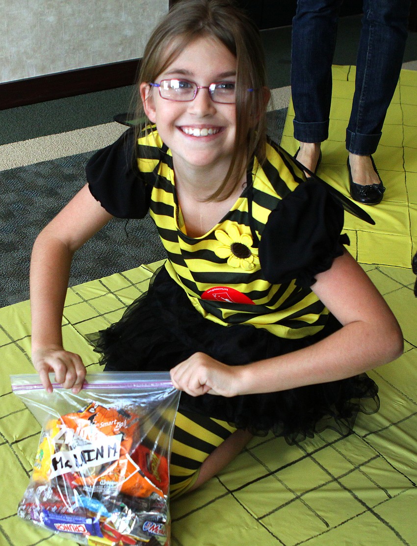 McLain Miller makes sure her bag of candy is sealed tight.
