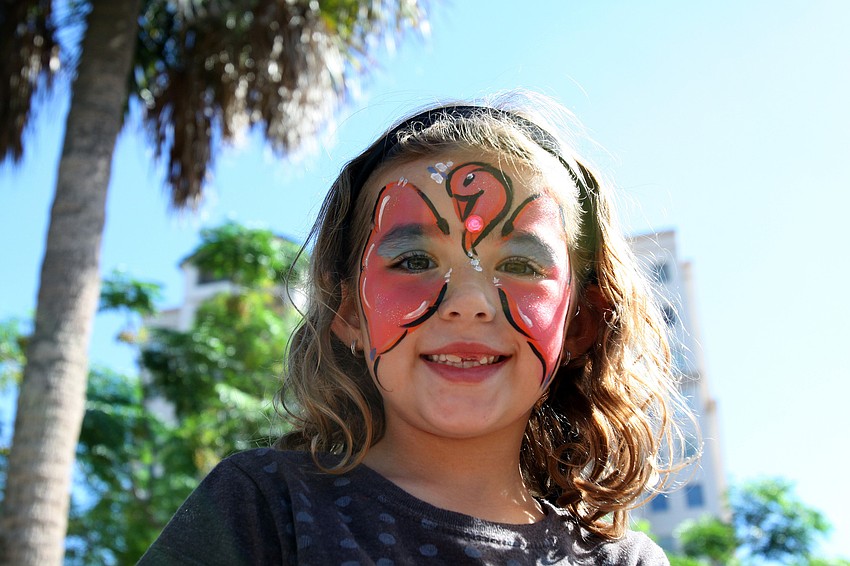 Sofia Boyle, 6, smiles with her painted face at the Chalk Festival.
