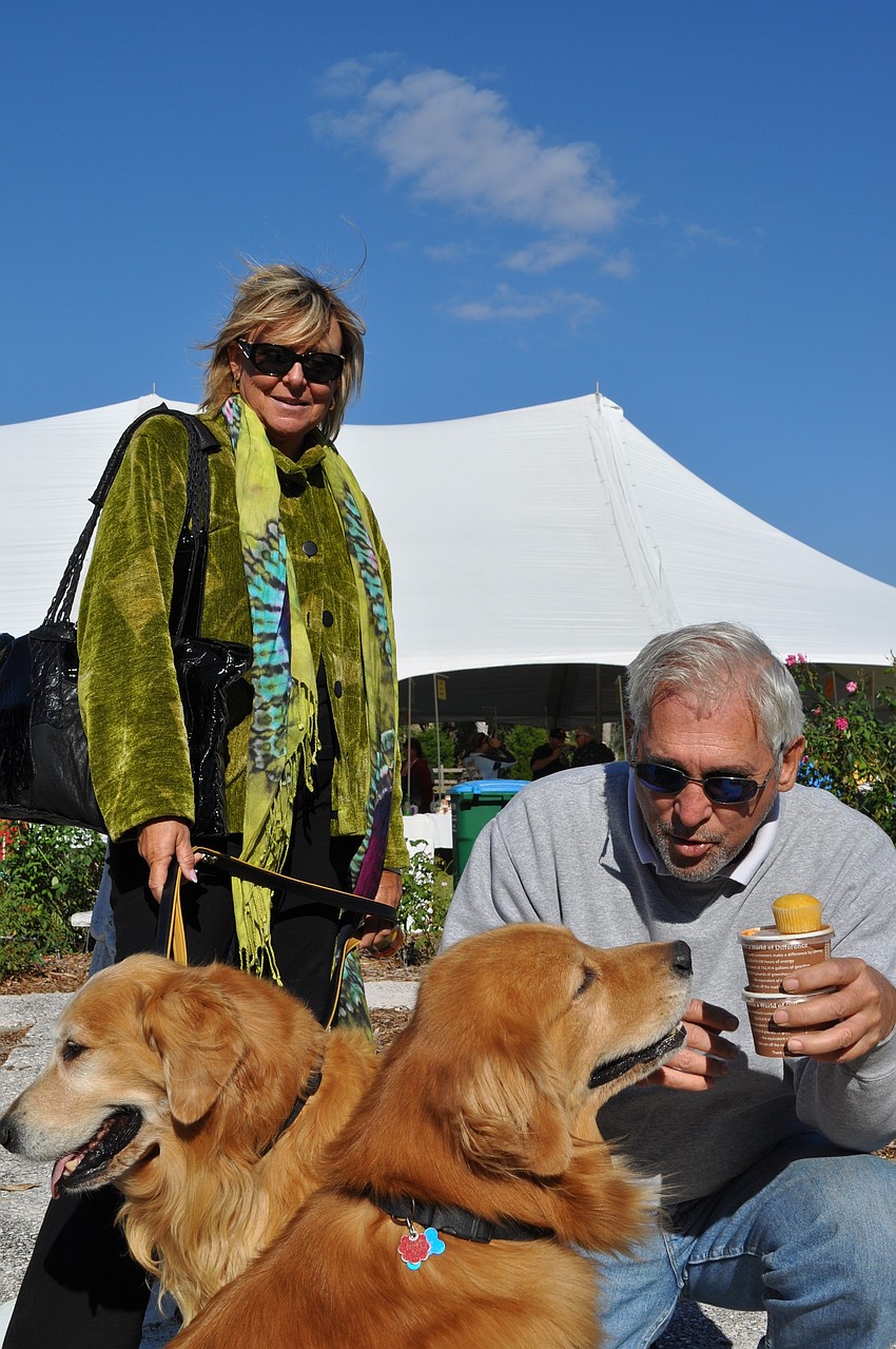 Ron Koelling, pictured with Joan Morgan and their golden retrievers Morgan and Cayl