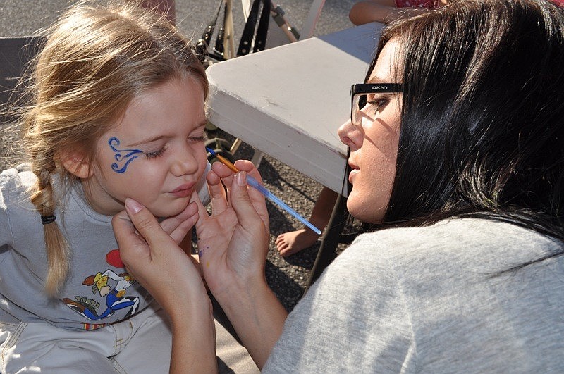 Emma Kapiotis, 4, had her face painted by Abbi Ptak.