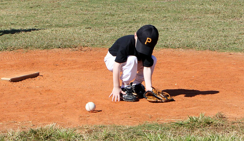 A runaway ball gets away from a Pirates player.