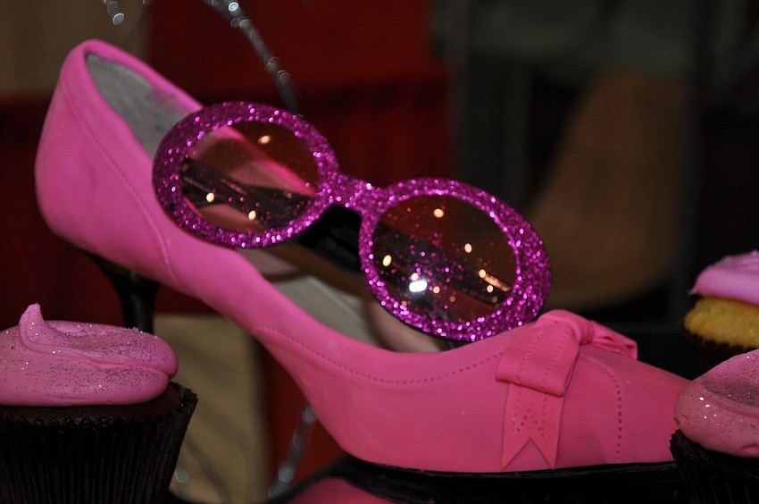 This pretty-in-pink edible shoe adorned a table of pink cupcakes.