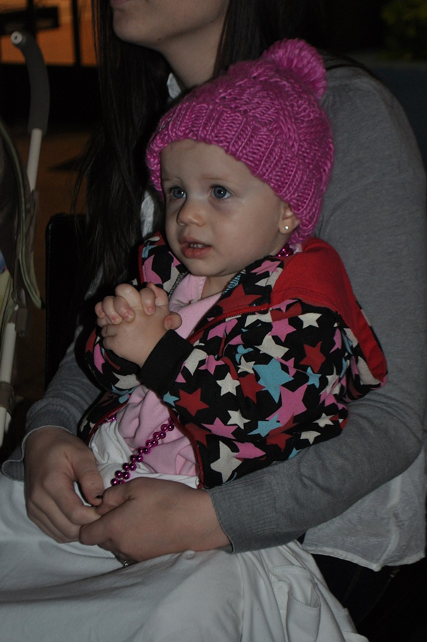 Ayden Helmer watches the parade