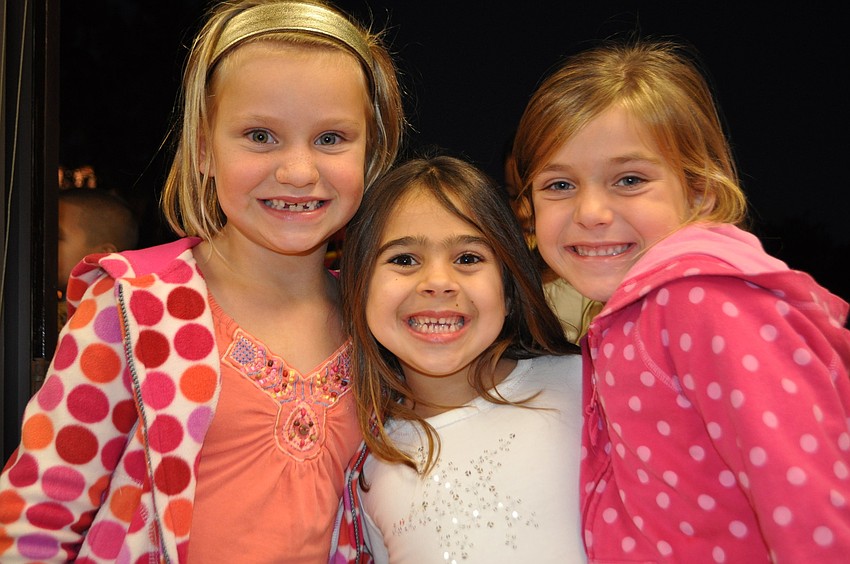Maya lane, Teagan Metnick and Madison Hiser are all smiles as they wait in line to see Santa.