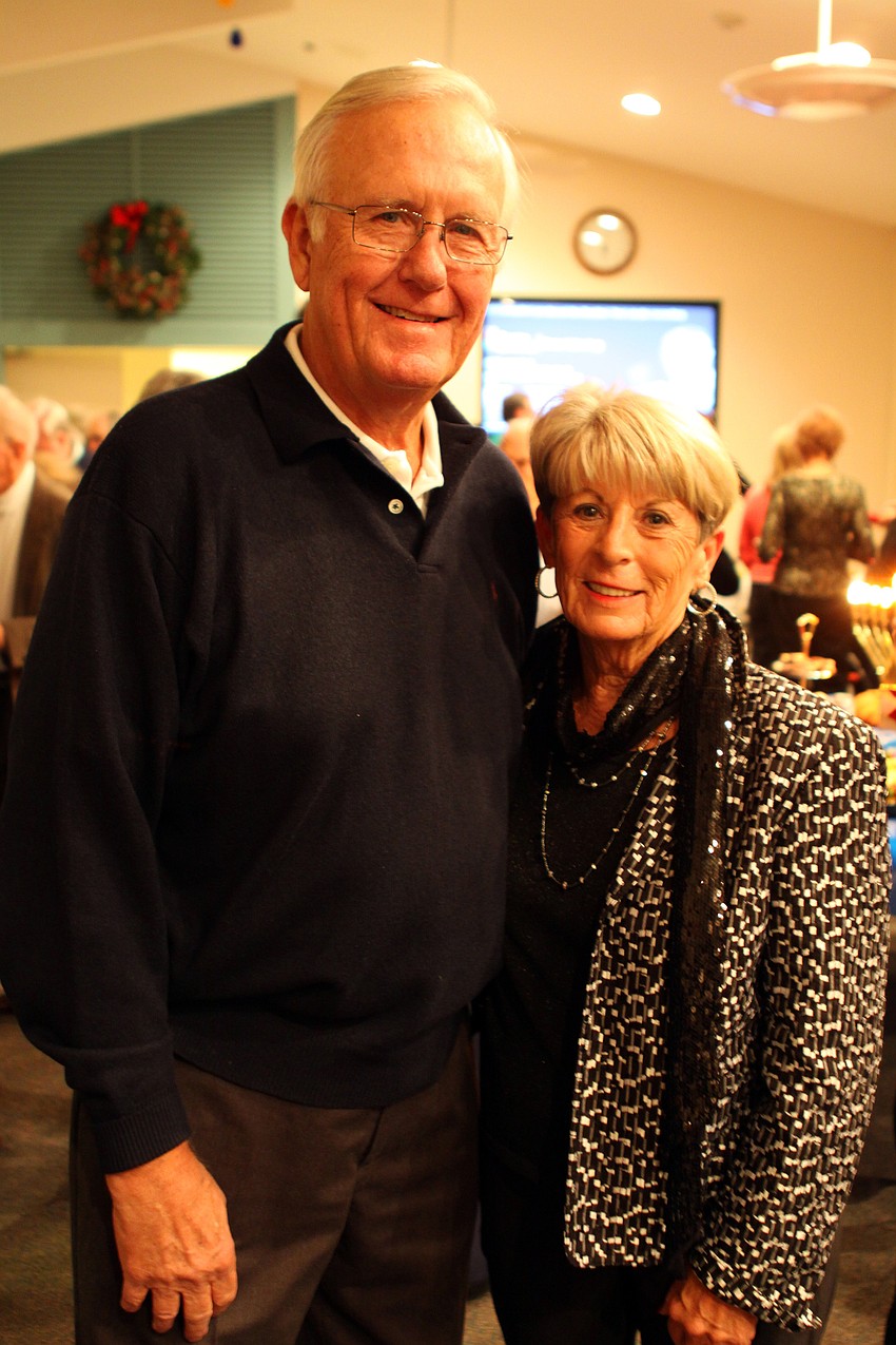 Dan and June Hessel cozy up next to one another at Seaplaceâ€™s Welcome Back Holiday Party on Wednesday, Dec. 15. June was one of the main organizers of the event.