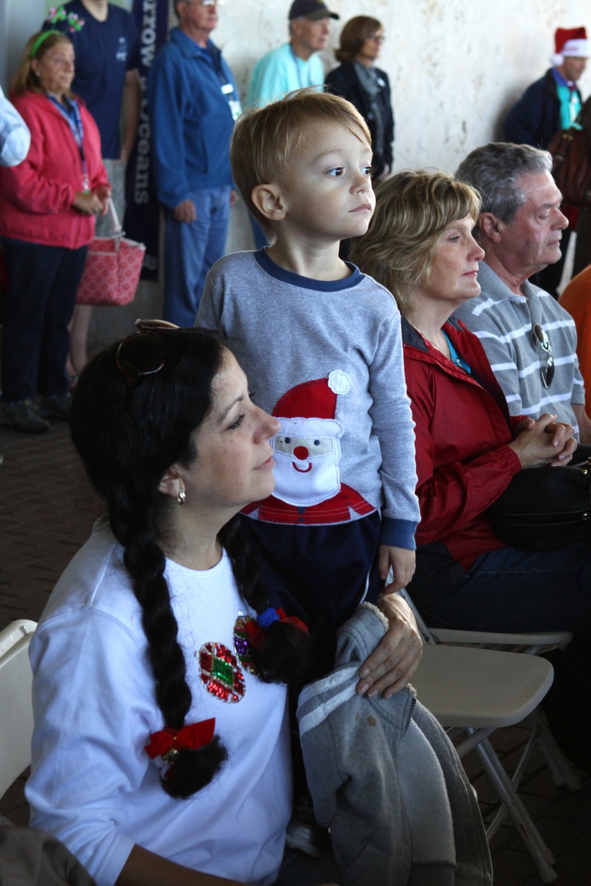 Rochelle Grossman and her son, Noah, enjoy watching and listening to the holiday performance put on by the Sarasota Orchestra on Tuesday, Dec. 21.