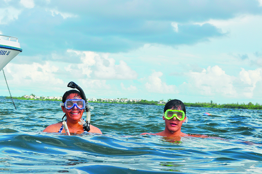 Grisel and Dwight McCain enjoy the water at the Sarasota Bay Watch Scallop Search in August.