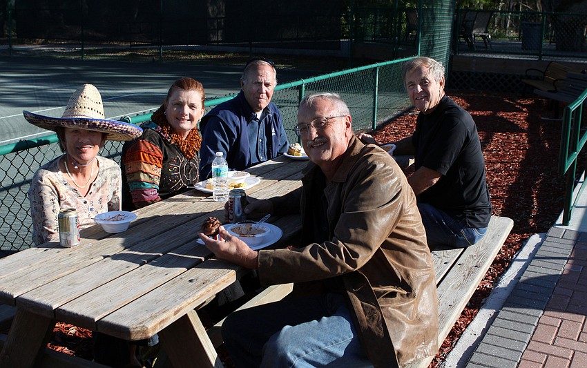 Rita Feder, Jane Johnson, John Beeman, Steve Glawitsch and R.C. Johnson enjoy some chili on Friday, Jan. 28 during Longboat Key Public Tennis Center's Chili Cook-off competition.